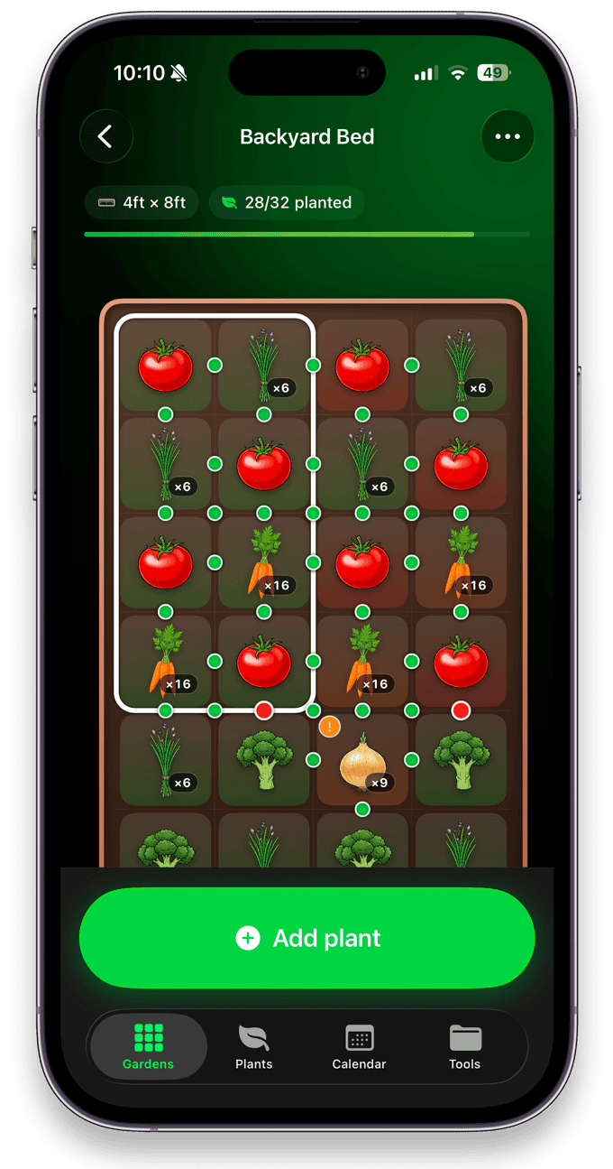 Niwa vegetable garden planner app showing a 4ft by 8ft raised bed laid out on a square foot gardening grid with tomatoes, carrots, broccoli and onions, 28 of 32 squares planted.